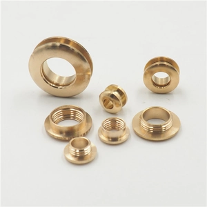 Assorted brass eyelet screw fasteners in various sizes for leather goods and handbags