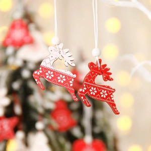 Red and white wooden elk Christmas tree ornaments with beads in a festive bokeh background