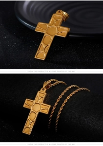 Close-up of golden cross pendant with textured geometric relief and twisted rope chain