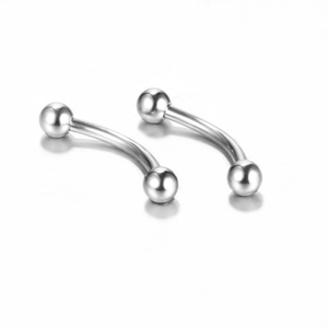 Macro shot of silver curved stainless steel eyebrow rings on a white background