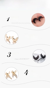 Detail view of crescent moon stud earrings with gold and black mirror polished finish