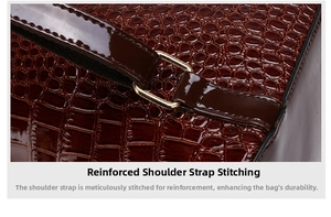 Detail of reinforced stitching and golden metal buckle on brown crocodile texture backpack