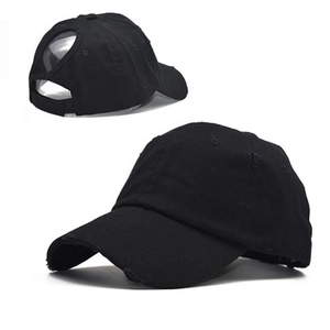 Detail of black cotton baseball cap showing back opening for high ponytail and mesh design