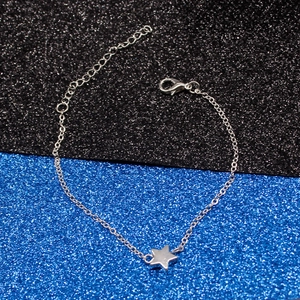 Detailed view of silver star pendant bracelet with lobster clasp and extension chain