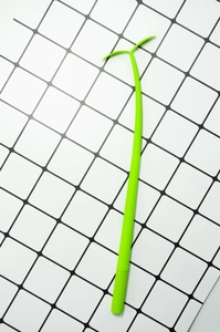 Close-up of green leaf-shaped silicone gel pen on a grid background for creative stationery