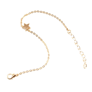 Detailed shot of golden star pendant with lobster clasp and adjustable extension chain