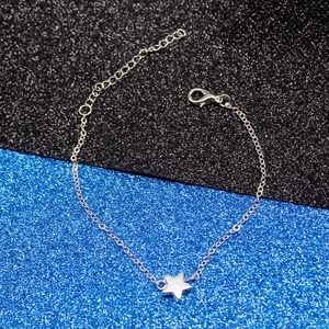 Detailed view of silver star pendant bracelet with adjustable chain and lobster clasp