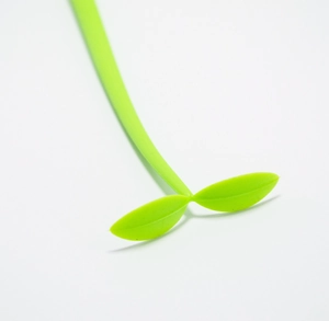 Macro detail of cartoon sprout clover gel pen showing soft silicone green leaves