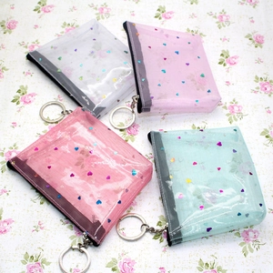 Set di quattro portamonete trasparenti in rete con paillettes a cuore in vari colori