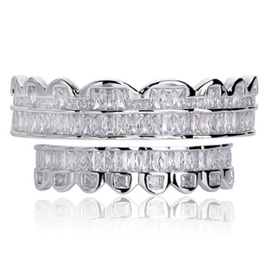 Close-up of silver-tone hip hop grillz set with pavé square-cut cubic zirconia crystals