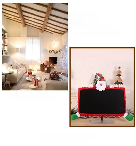 Detail of red elastic Christmas monitor cover featuring 3D Santa Claus figure decoration