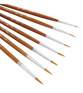 Macro detail of 7 professional fine liner brushes with wooden handles and nylon bristles