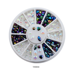 Assorted nail art rhinestone set with multi-shape crystals in a white rotating wheel box