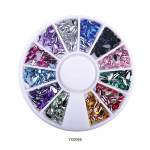 Detailed view of 12-slot round wheel container filled with colorful nail art rhinestones