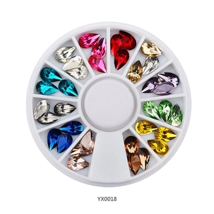 Multi-color teardrop nail art rhinestones set in a 12-compartment round wheel case