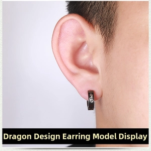 Close-up of black stainless steel clip-on earring featuring a silver dragon pattern