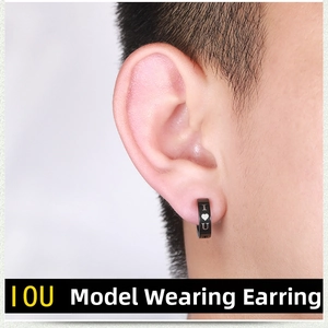 Close-up of black titanium steel ear clip featuring I Love U engraving on male model