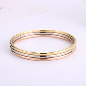 Minimalist stackable 3mm titanium steel bangles in gold, silver, and rose gold finish