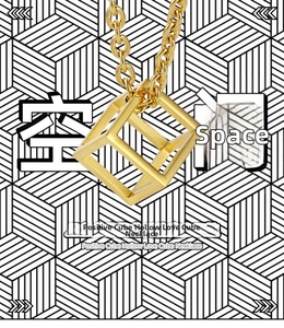 Macro detail of a geometric hollow cube pendant in gold finish with a minimalist aesthetic