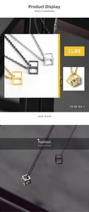 Detailed view of hollow geometric cube pendants in gold, silver, and black titanium steel
