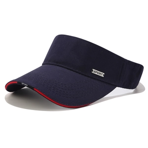 Close-up of SPORT metal tag on navy blue sun visor with red and black edge piping