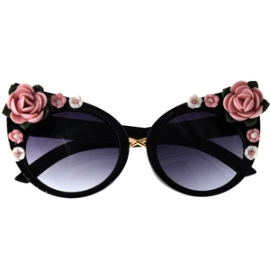 Close-up of black round frames with gradient purple lenses and pink resin floral details
