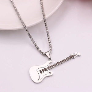 Macro detail of a silver guitar pendant necklace featuring elegant sparkling rhinestones