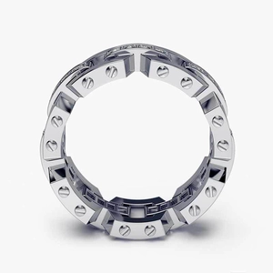 Macro shot of silver ring featuring screw motifs and pavé cubic zirconia setting