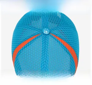 Macro detail of breathable royal blue mesh fabric and orange stitching on sun hat