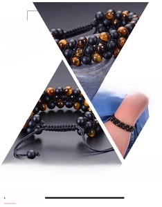 Detailed close-up of tiger eye and matte stone beads on a multi-layer woven bracelet