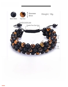 Detailed view of 6mm tiger eye and matte stone triple-row braided adjustable bracelet