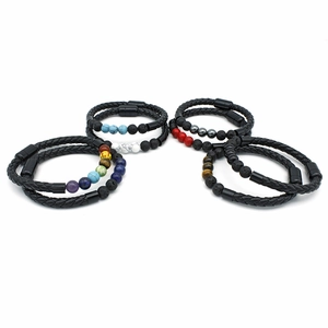 Detail of men's braided leather bracelets with natural stone beads and magnetic clasp