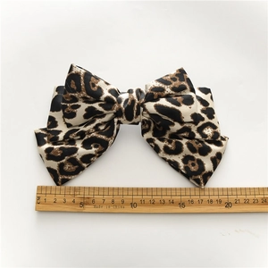 Satin leopard print bow hair clip with 19cm width shown on white background