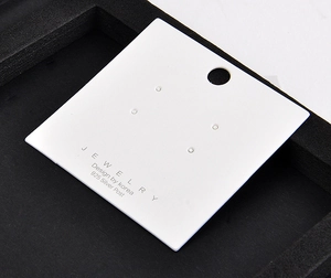 Detail view of a white jewelry earring display card with '925 Silver Post' text