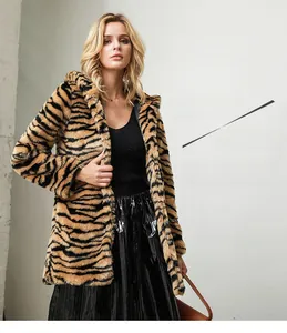 Detail of tiger print faux fur coat showing plush texture and winter lapel design