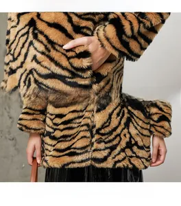 Detail view of tiger print faux fur coat showing sleeve cuffs and plush texture quality
