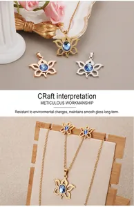 Detail of floral necklace and studs set with blue zircon center in three metal tones