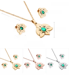 Detail view of floral stainless steel jewelry set with green zircon in three color finishes