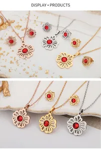 Macro shot of floral hollow pendants with red zircon stones in rose gold and silver