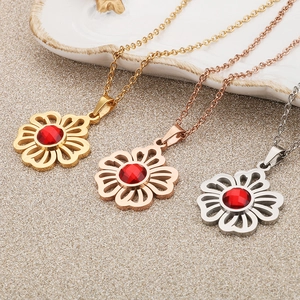 Three hollow floral necklaces with red zircon in gold, rose gold and silver finishes