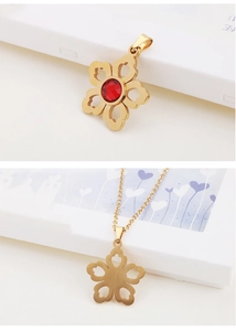 Detailed front and back view of gold flower necklace featuring a round red gemstone