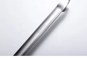 Detail showing SUS304 stainless steel logo engraved on a thick metal funnel handle