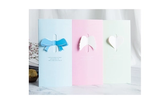 Detailed view of 3D butterfly and heart cards in pastel blue, pink, and green colors