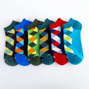Detail of six men's low-cut socks featuring various colorful geometric argyle patterns
