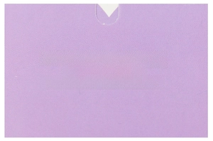 Close-up of purple greeting card with white inspirational quote and smooth texture