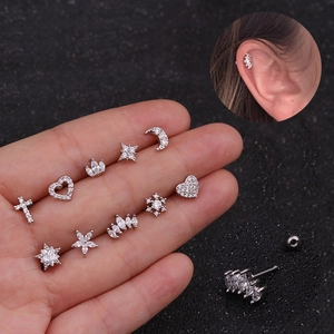 Detailed set of silver zircon helix earrings with screw backs in flower and cross designs