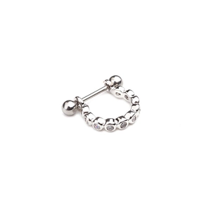 Close-up of U-shaped silver ear stud with clear cubic zirconia pavé and barbell ball screw back