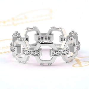 Macro view of silver geometric chain ring featuring hollow hexagons with zircon accents