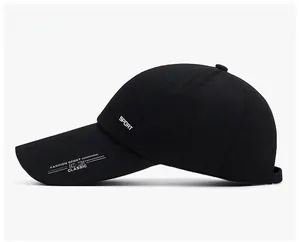 Detail view of black cotton baseball cap side profile with white SPORT embroidery