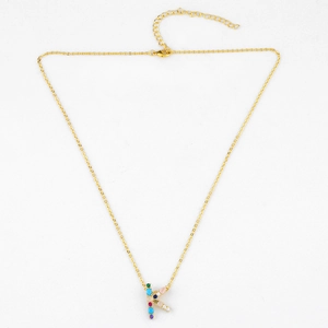 Detail of gold letter K pendant featuring colorful zircon stones and adjustable lobster clasp